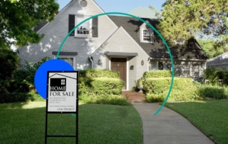 Image of a charming house with a steep roof and a "for sale" sign in a residential area