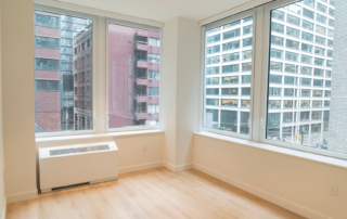 Newly converted residential space with large windows and minimalist decor