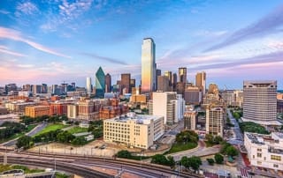 Aerial view of the dallas skyline, featuring modern and traditional architecture