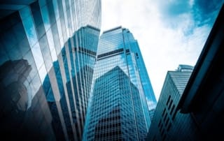 A cityscape with modern skyscrapers and reflective glass facades