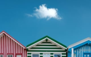 Three colorfully striped houses along florida's coastline