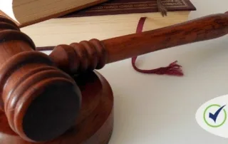 Wooden gavel and legal books representing justice and law, with "cres claimprevent" logo.