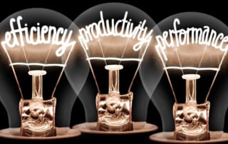 Image of three glowing light bulbs featuring the words "efficiency," "productivity," and "performance"