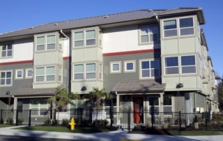 A modern multi-story residential building for low-income and emergency housing