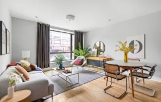 Mastering Real Estate Staging In Nyc'S Competitive Market 6 A modern living and dining area showcasing sophisticated and tasteful staging