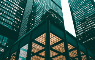 Image of modern skyscrapers in an urban financial district with sleek glass and steel exteriors.