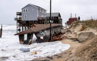 A collapsed house on the outer banks shore due to erosion