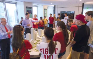 Building The Future: The Usc Price School'S Trailblazing Real Estate Development Program 5 Students examining architectural model for urban planning