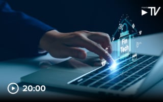 A hand interacting with a laptop keyboard, surrounded by digital fintech graphics.