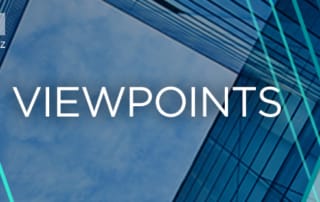 An upward view of modern glass buildings with the word "viewpoints" and mintz logo in the corner.
