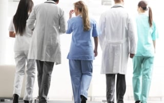 Healthcare professionals walking in a healthcare facility