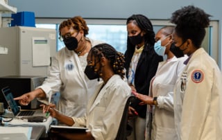 A group of medical professionals collaborating in a lab