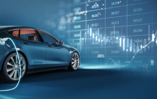 A modern blue electric vehicle charging amidst financial charts and cityscape