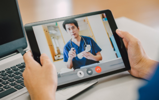 Image of a telehealth consultation in progress featuring a healthcare professional on a video call