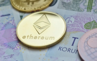 Close-up of ethereum cryptocurrency coin with paper money