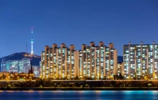 South korean high-rise buildings by night with namsan tower in view