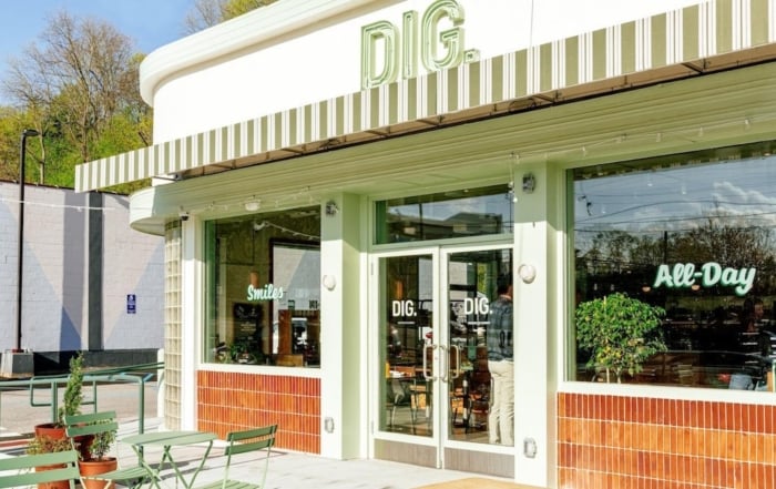 Exterior view of dig restaurant with inviting patio and sunlight