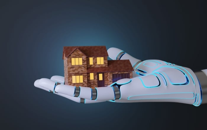 A futuristic robotic hand with blue glowing lines holds a small brick house with a warm glowing interior