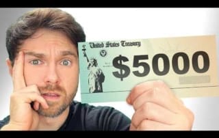A person holding a mock united states treasury check displaying $5000