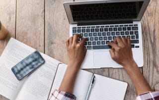 Study workspace with laptop and books