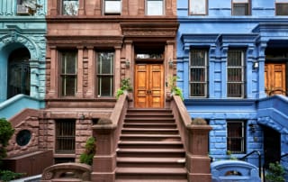 Urban townhouses with detailed architecture and vibrant colors