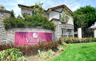 Villa rosa property sign with pink background and white lettering