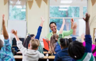 Cheerful classroom setting with teacher and students actively participating