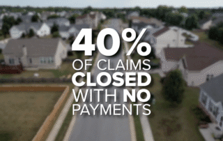 40% of insurance claims closed with no payments message over blurred aerial view of a suburban neighborhood street.