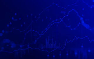 Blue financial data background with multiple line graphs, candlestick markers, and bar charts on a dark grid.