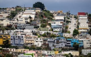 Colorful hillside neighborhood with tightly packed houses and steep streets