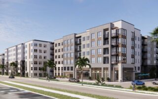Modern mid-rise apartment building with palm trees along a wide street under a clear blue sky