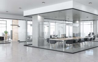 Modern open-plan office with glass-walled conference room and city view