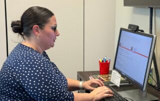 The 50‑Year Mortgage Debate: Lifeline For Buyers Or Decades Of Debt? 5 Person working at a desk on a desktop computer in an office.