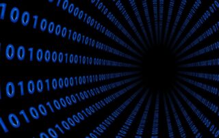 Blue binary code digits forming a tunnel on a black background, symbolizing digital data flow.