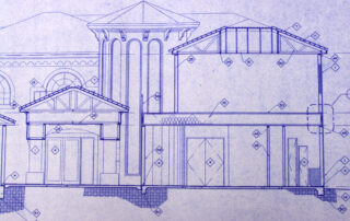 Architectural blueprint drawing of a multi‑story building facade with columns, arched windows, and detailed structural notes.