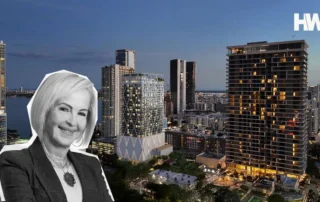 Black-and-white portrait of a businesswoman overlaid on a twilight city skyline with modern high-rise buildings.